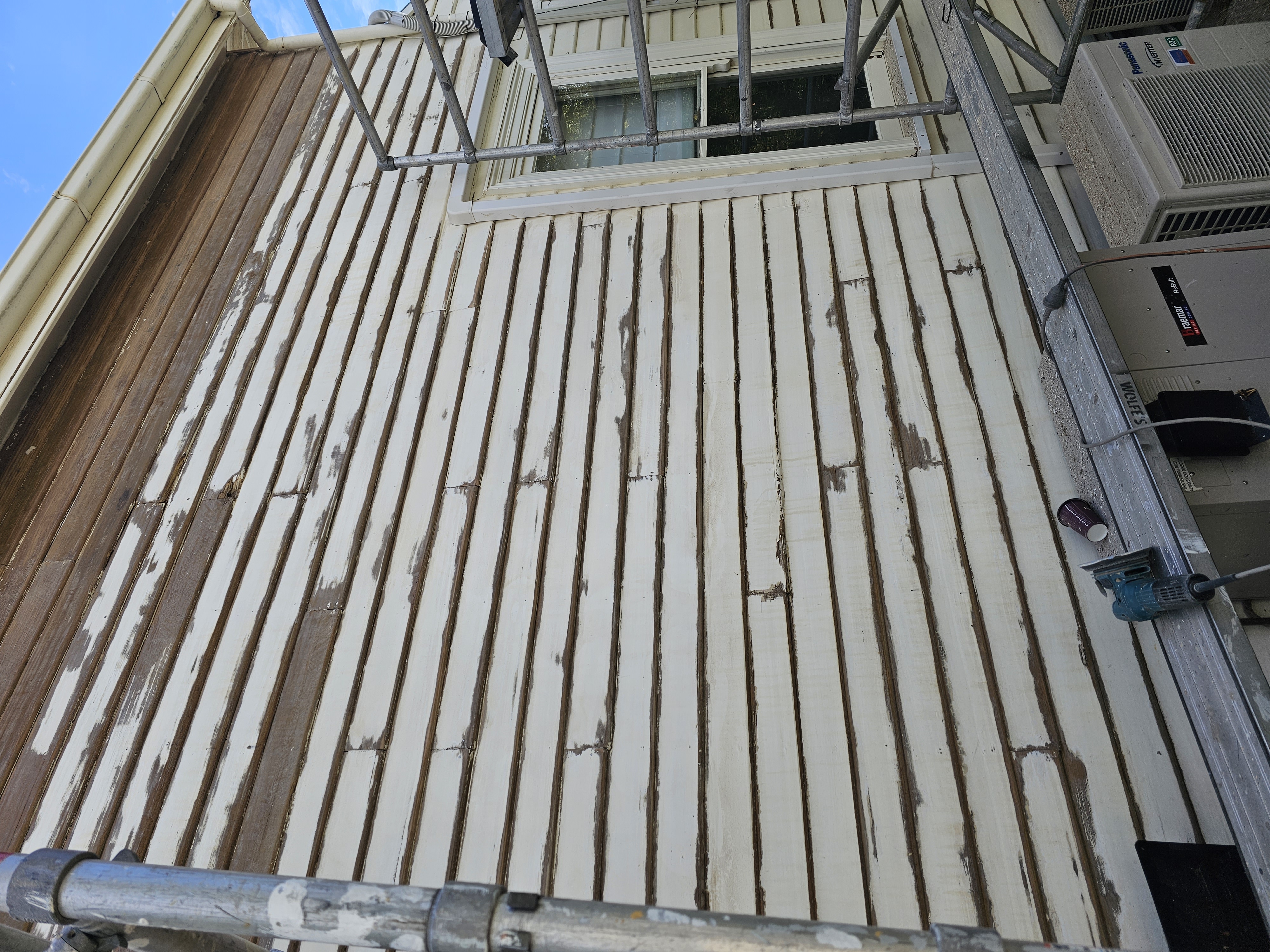 Extensive weatherboard preparation including sanding and spot priming before repainting a home in Montagu Street, New Town, Hobart.